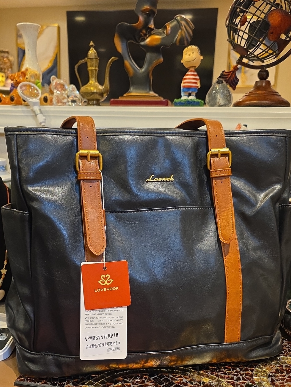 Spacious Black Tote with Tan Interior and Straps - Picture 1 of 8